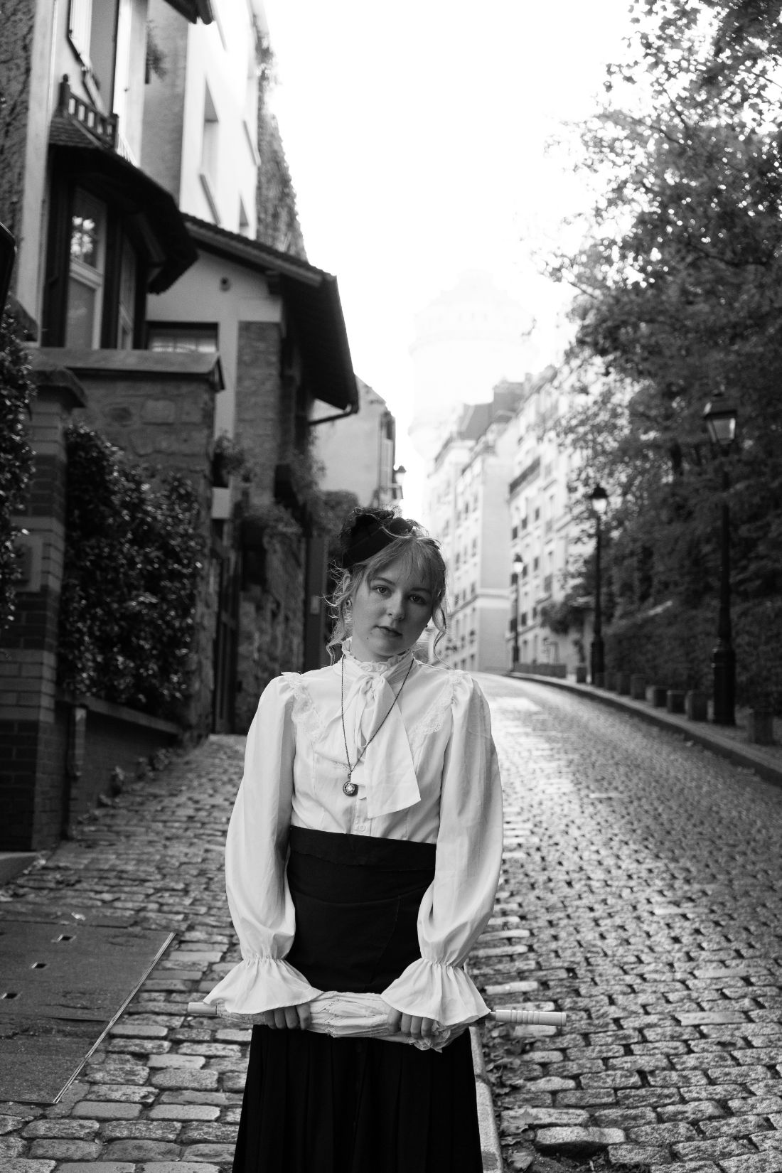 Miss Time Traveler on a cobbled street of Montmartre